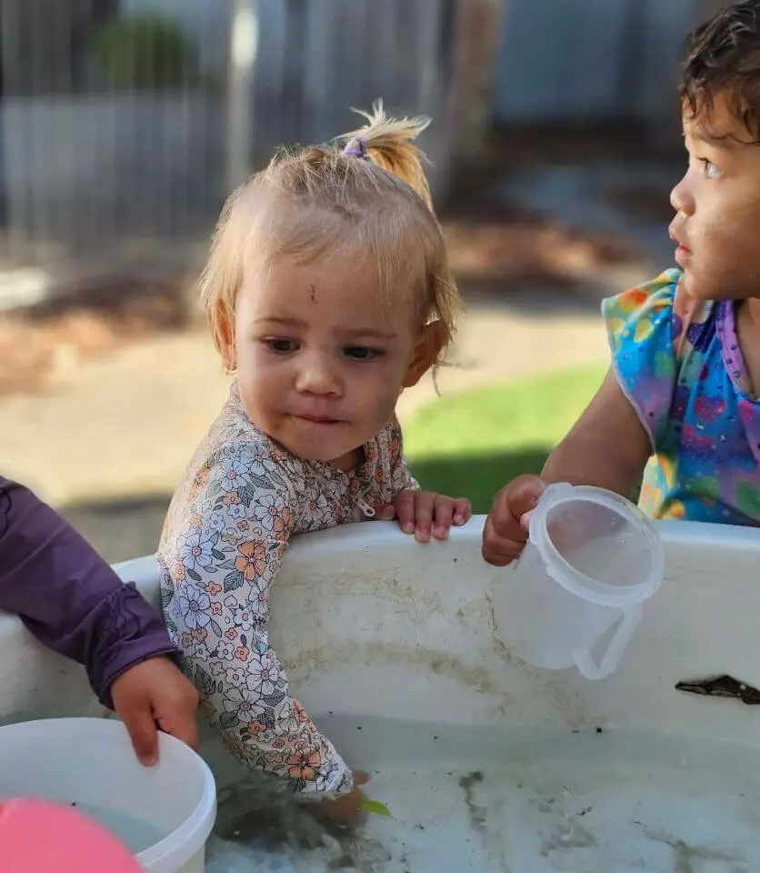 playing with water at Auckland daycare